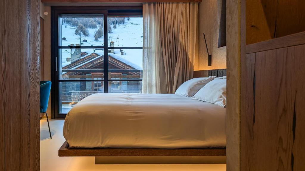 Postel nebo postele na pokoji v ubytování Mohe Boutique Hotel