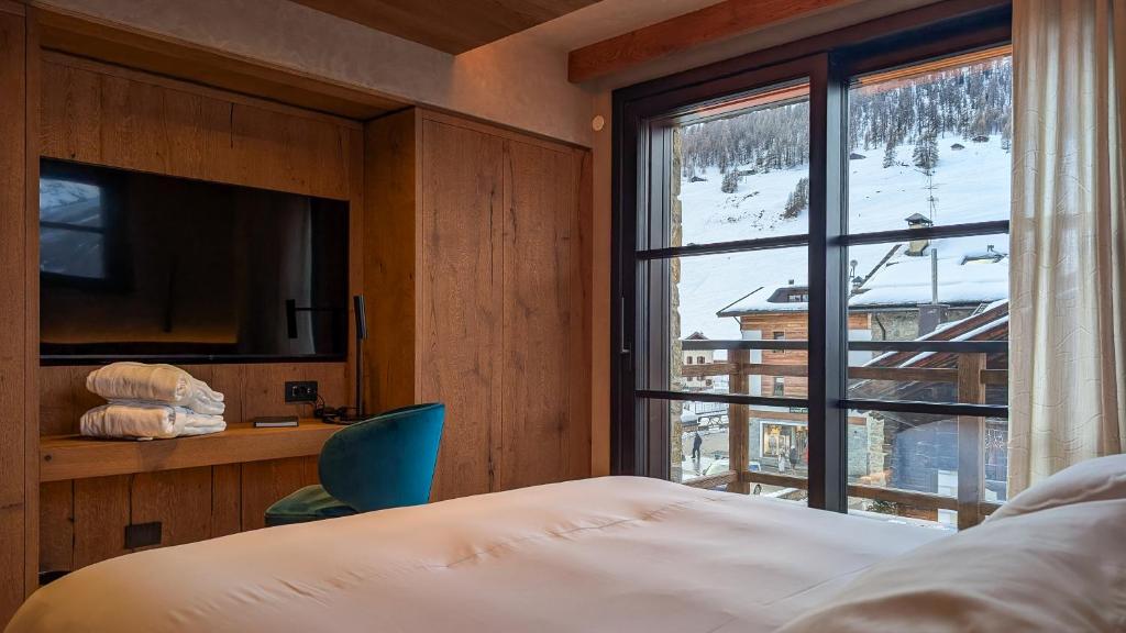 Postel nebo postele na pokoji v ubytování Mohe Boutique Hotel