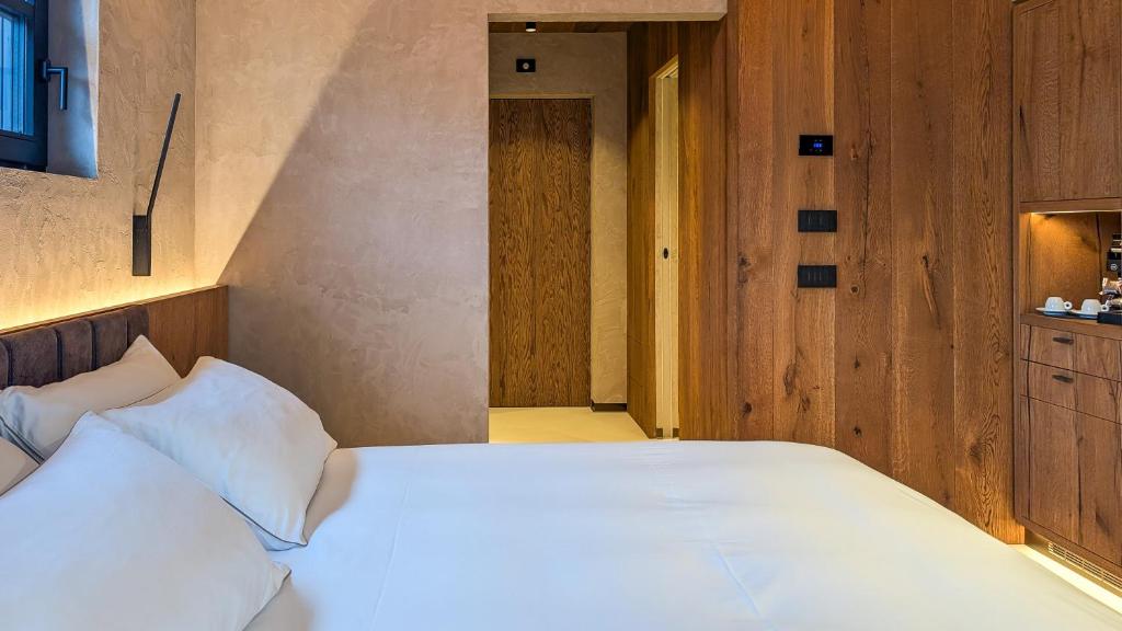 Postel nebo postele na pokoji v ubytování Mohe Boutique Hotel