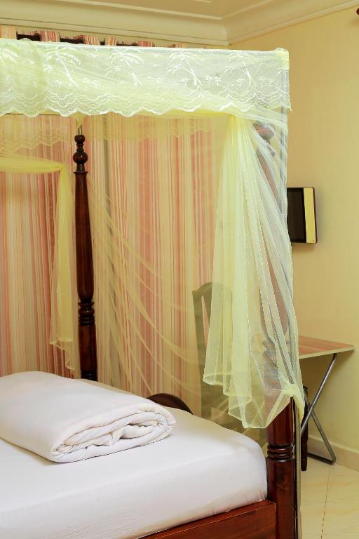 Postel nebo postele na pokoji v ubytování Palace Hotel