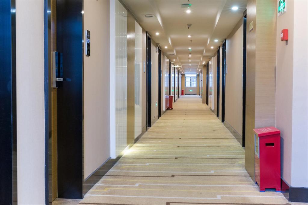 a corridor of an office building with a hallway of halls at Lavande Hotel Foshan Shunde Ronggui in Shunde