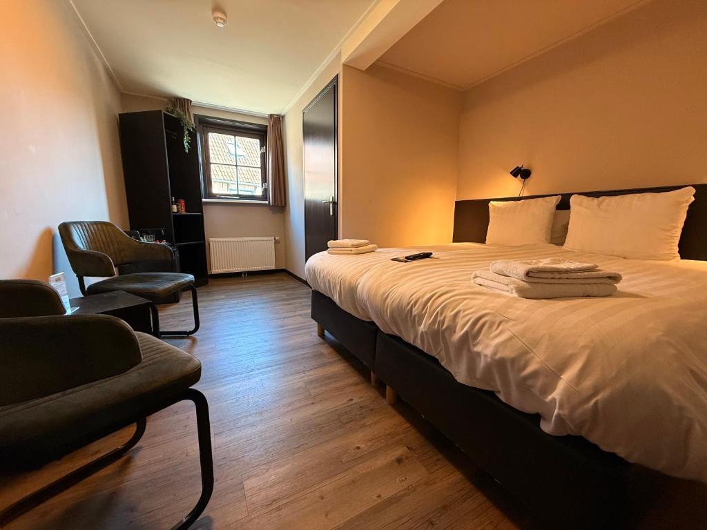 Postel nebo postele na pokoji v ubytování Bij Hen op Ameland