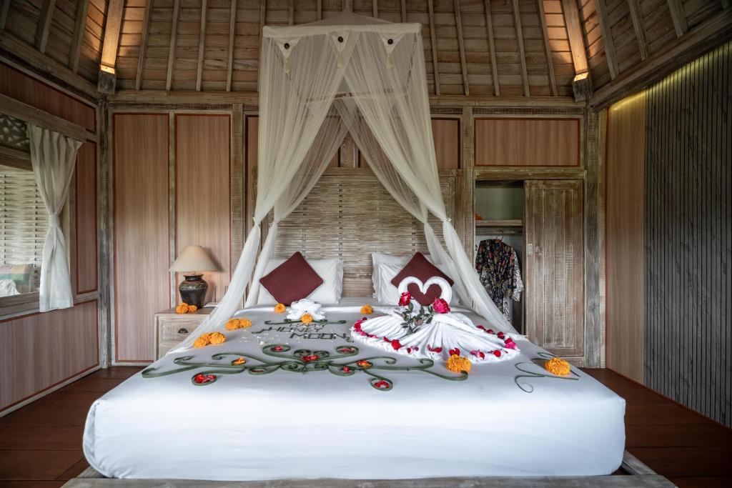 Postel nebo postele na pokoji v ubytování Uma Caming Villa Ubud