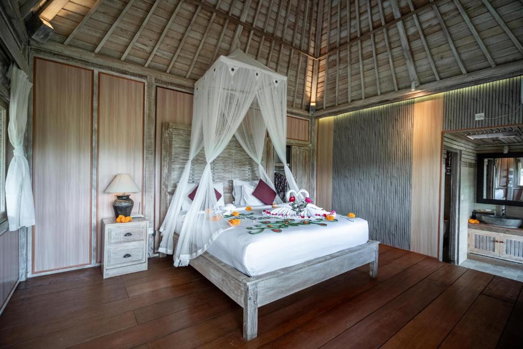 Postel nebo postele na pokoji v ubytování Uma Caming Villa Ubud