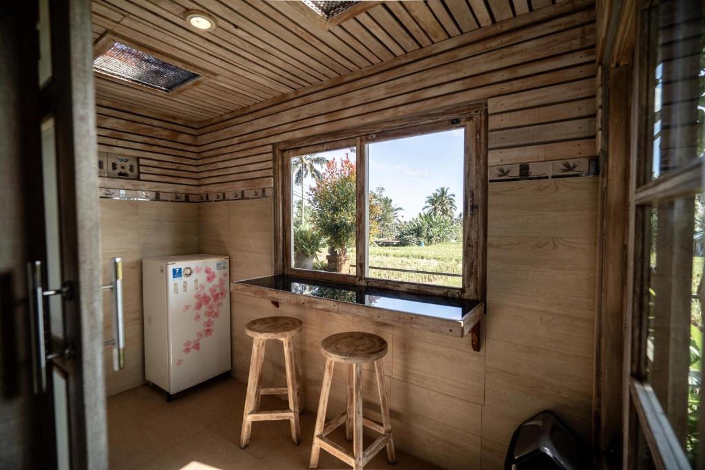 Kuchyň nebo kuchyňský kout v ubytování Uma Caming Villa Ubud