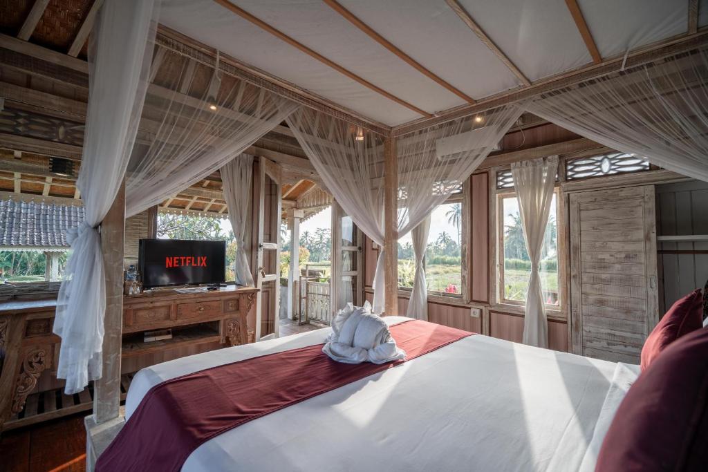 Postel nebo postele na pokoji v ubytování Uma Caming Villa Ubud