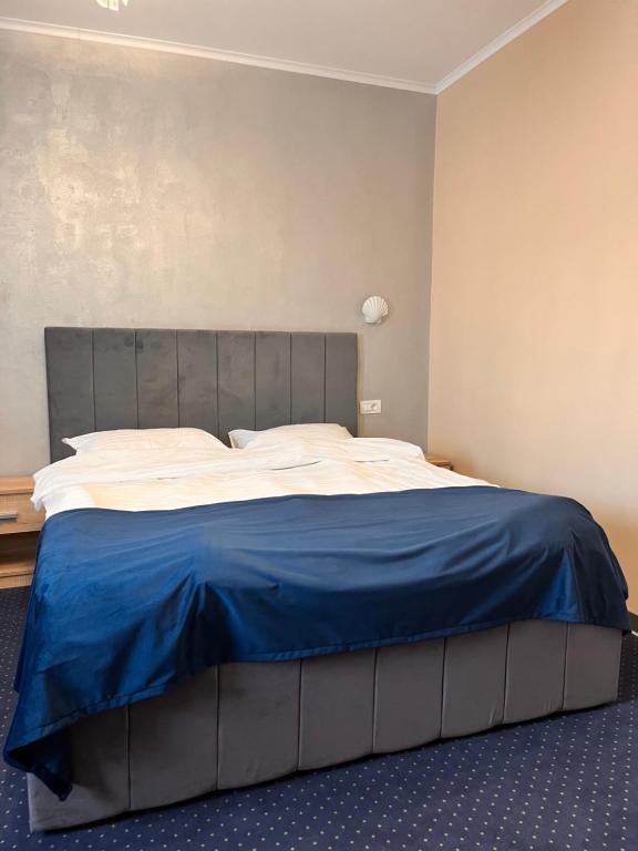 Postel nebo postele na pokoji v ubytování Live Tulcea Hotel