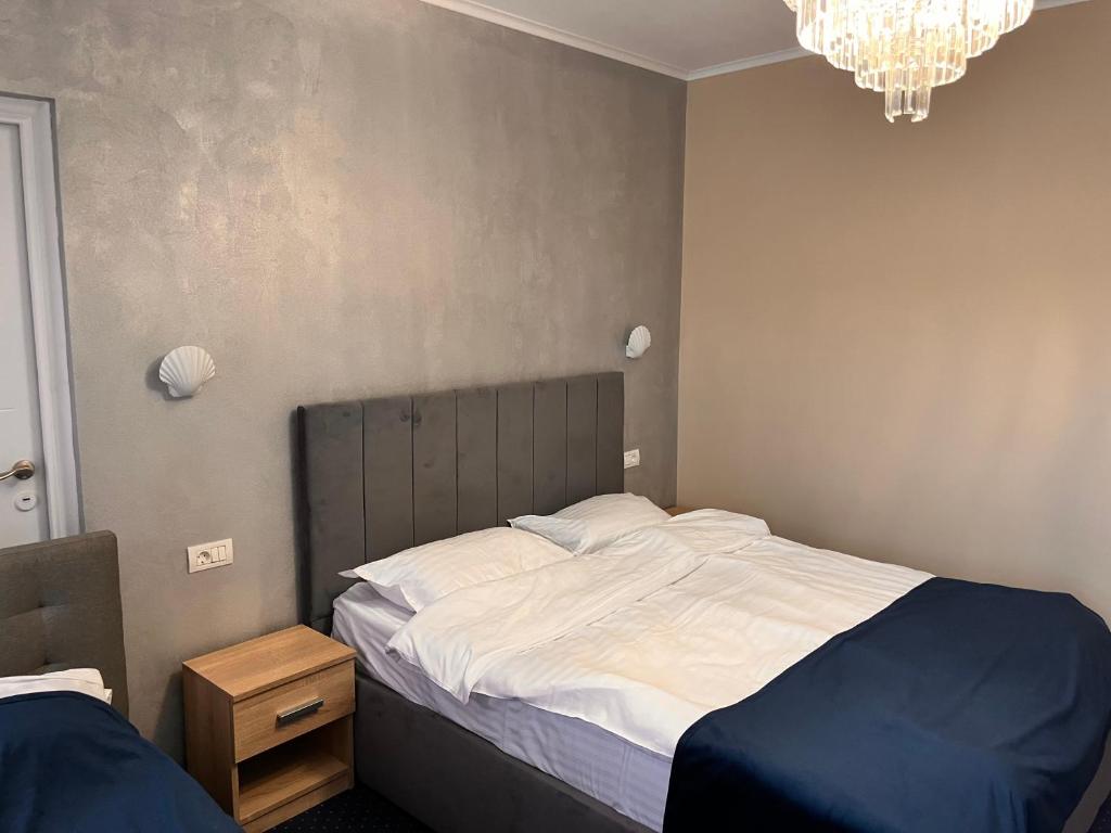 Postel nebo postele na pokoji v ubytování Live Tulcea Hotel