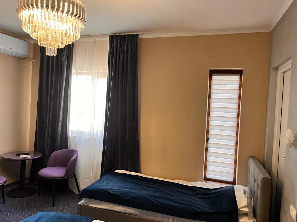 Postel nebo postele na pokoji v ubytování Live Tulcea Hotel