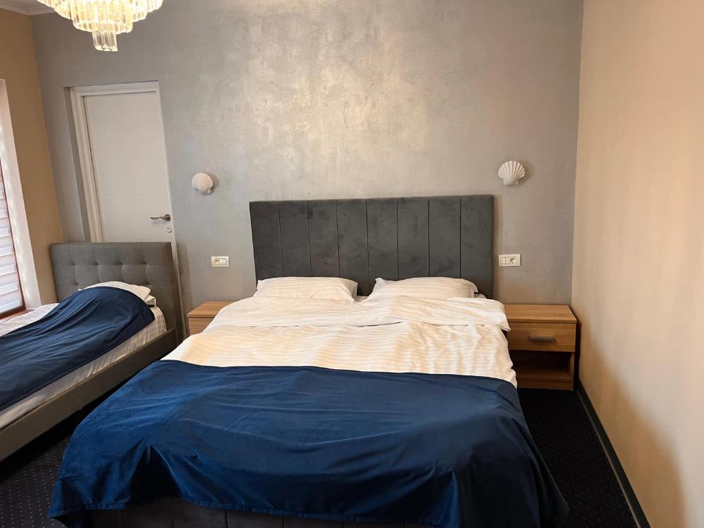 Postel nebo postele na pokoji v ubytování Live Tulcea Hotel