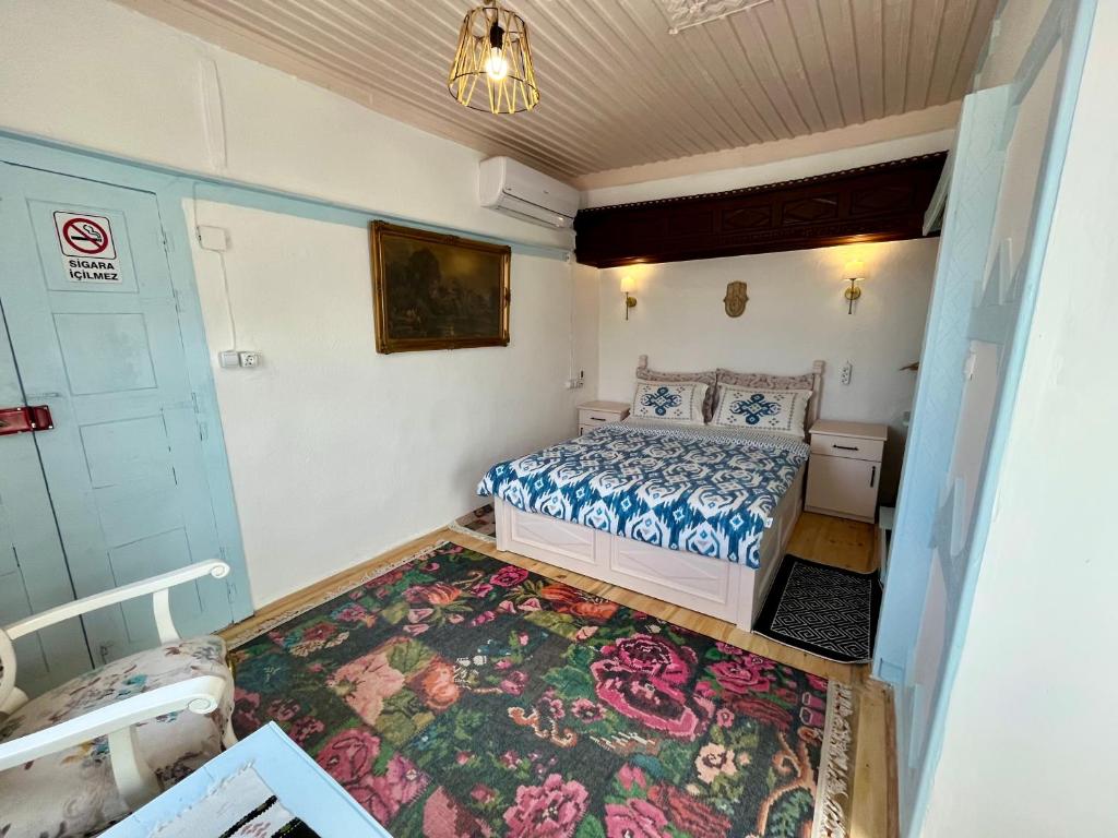 A bed or beds in a room at Mystic Konak