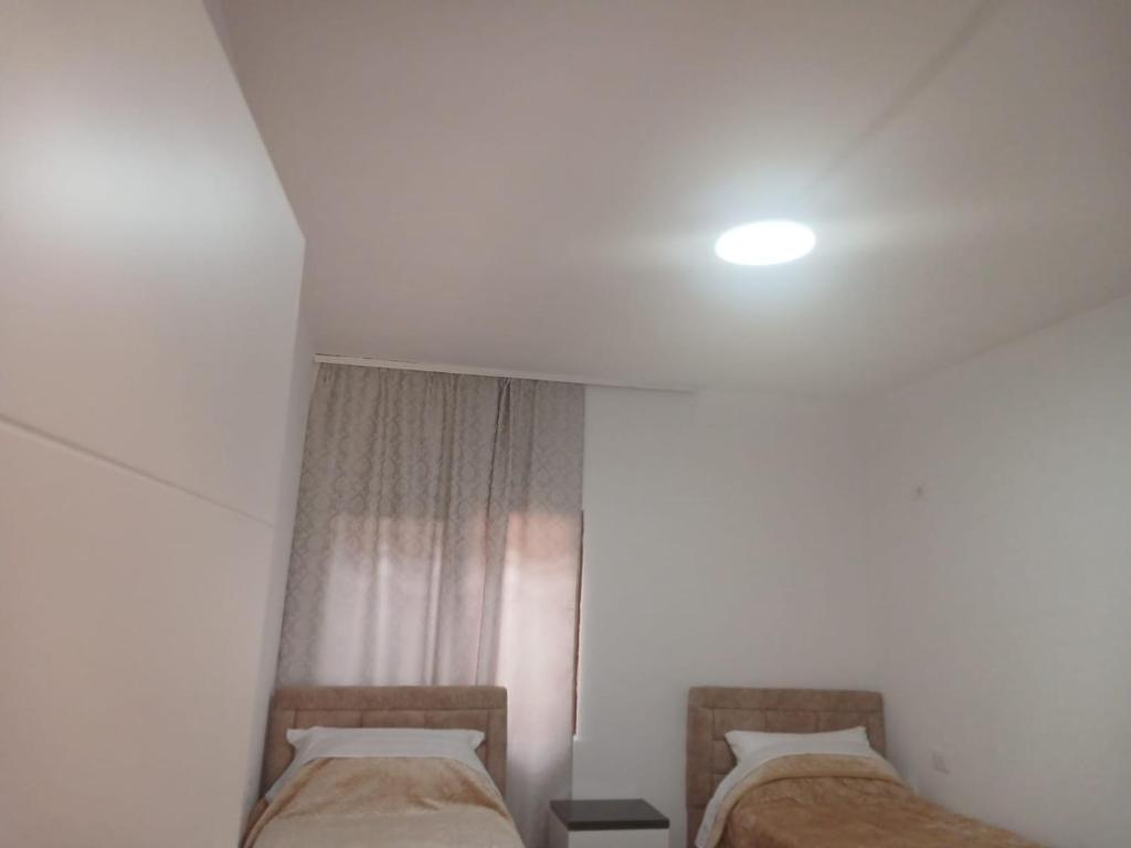 Postel nebo postele na pokoji v ubytování Bujtina Dalmacia