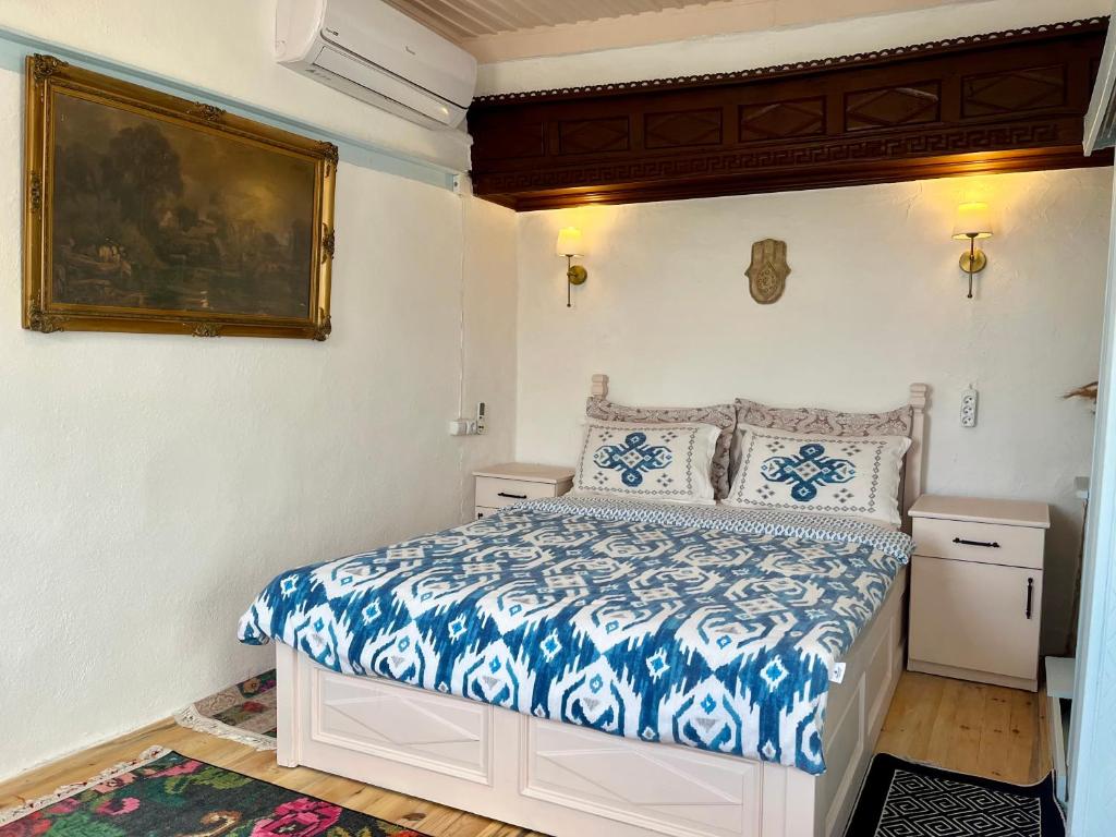 A bed or beds in a room at Mystic Konak
