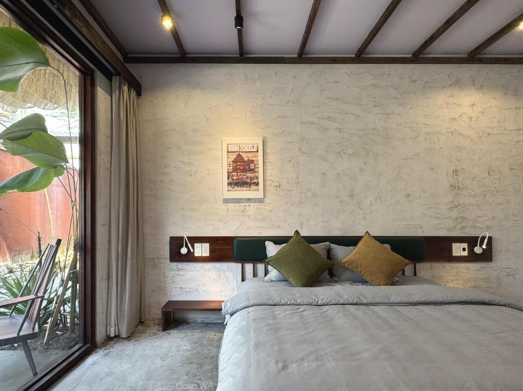 Postel nebo postele na pokoji v ubytování CasaWa Homestay Hue