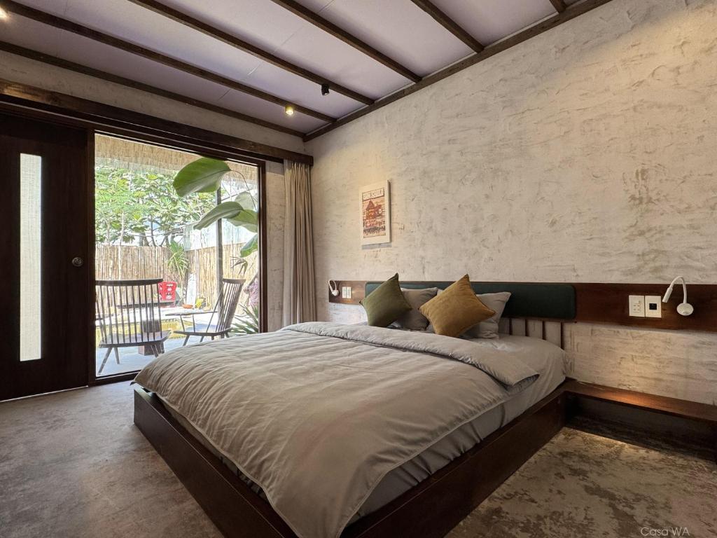 Postel nebo postele na pokoji v ubytování CasaWa Homestay Hue
