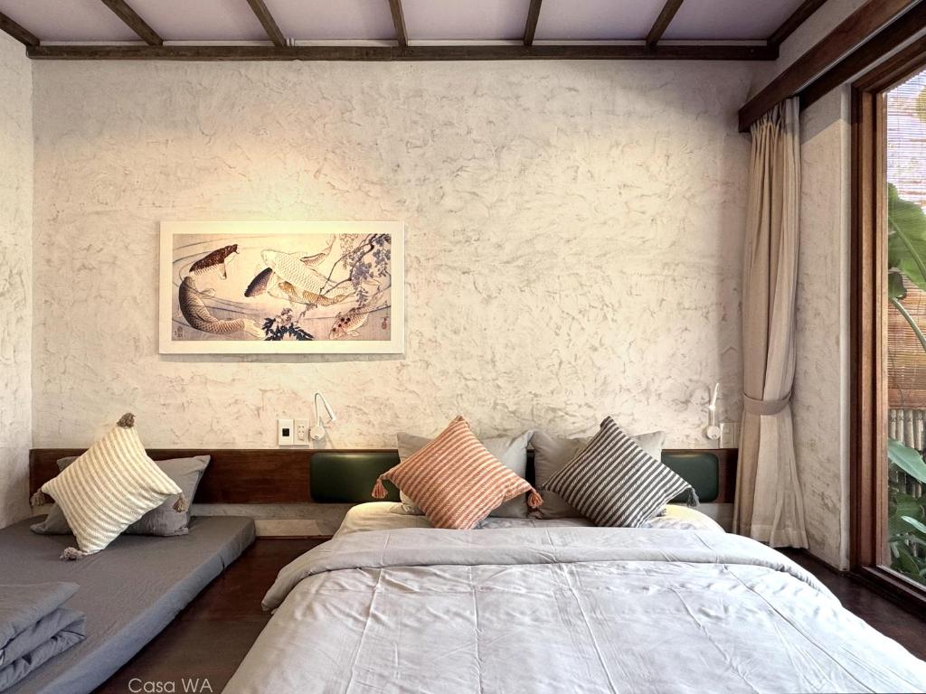 Postel nebo postele na pokoji v ubytování CasaWa Homestay Hue