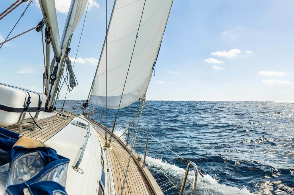 a sail boat in the ocean on the water at Rent a Cabin on a Sailing Yacht! in Pula