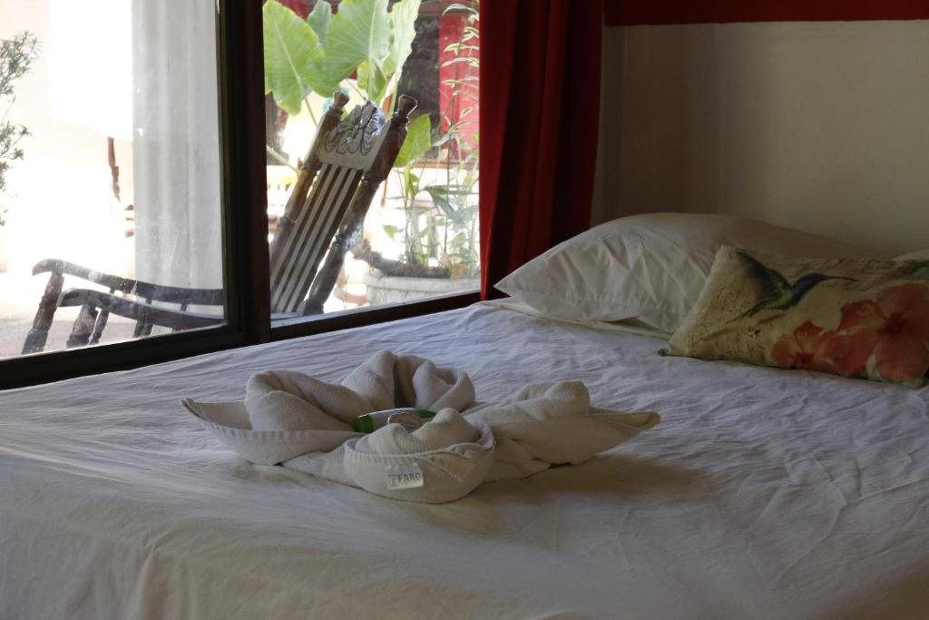 Postel nebo postele na pokoji v ubytování Hotel Hibiscus