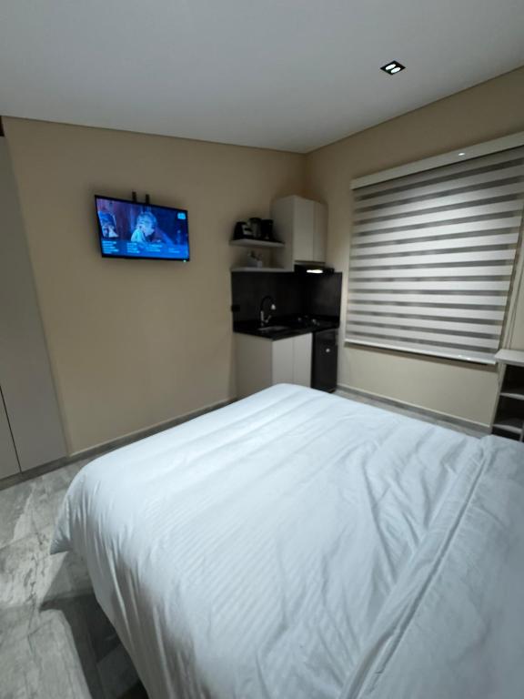 Postel nebo postele na pokoji v ubytování Increíble ApartaEstudio 1 Para Tu Estadía En Tunja