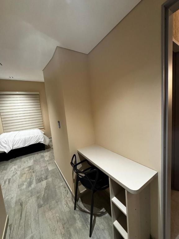 Postel nebo postele na pokoji v ubytování Increíble ApartaEstudio 1 Para Tu Estadía En Tunja