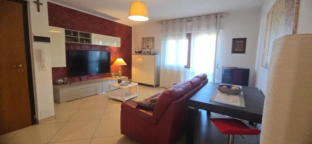 a living room with a couch and a table at Casa Myra Relax - Fronte Mare - in Ortona