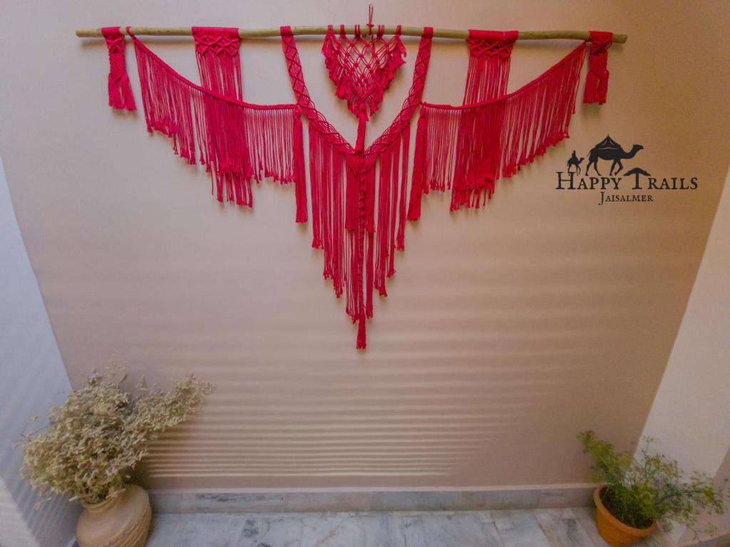 a heart shaped valentines garland hanging on a wall at Happy Trails Jaisalmer in Jaisalmer