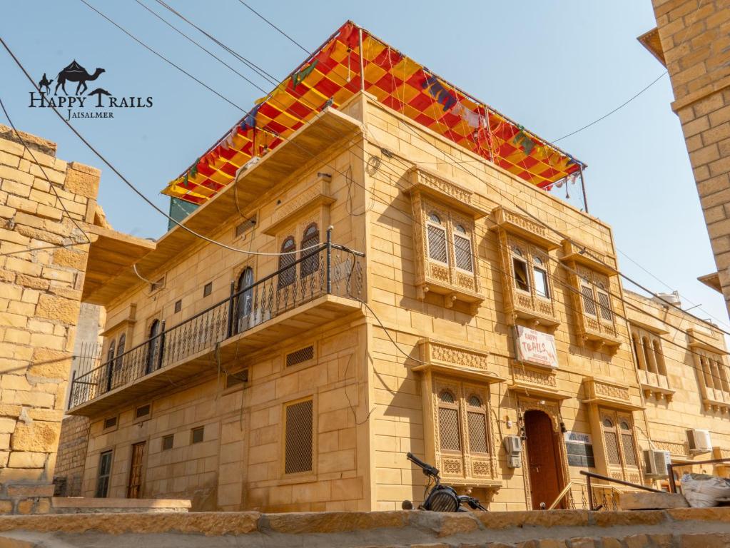 a building with a colorful roof on top of it at Happy Trails Jaisalmer in Jaisalmer