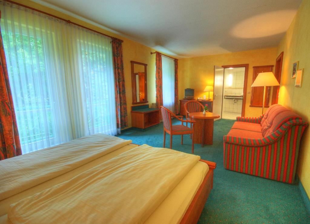 Postel nebo postele na pokoji v ubytování Meister BÄR HOTEL Vogtland