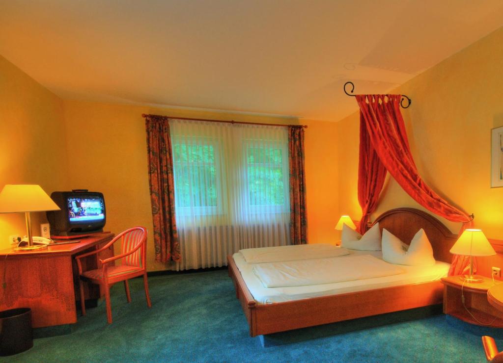 Postel nebo postele na pokoji v ubytování Meister BÄR HOTEL Vogtland