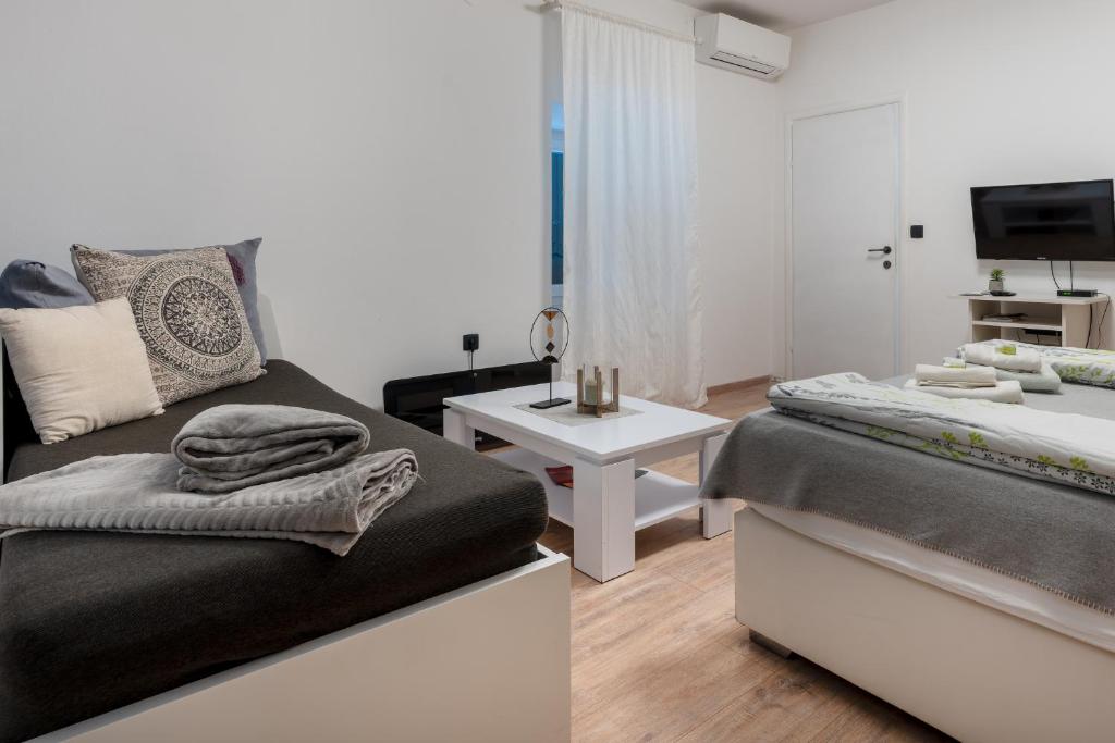 Posteľ alebo postele v izbe v ubytovaní Apartments Villa Sol