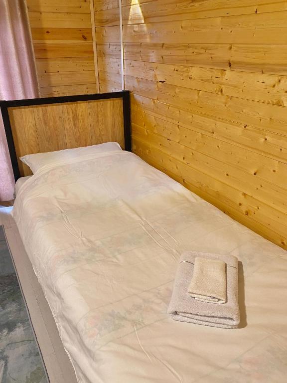 Postel nebo postele na pokoji v ubytování Bai Hotel