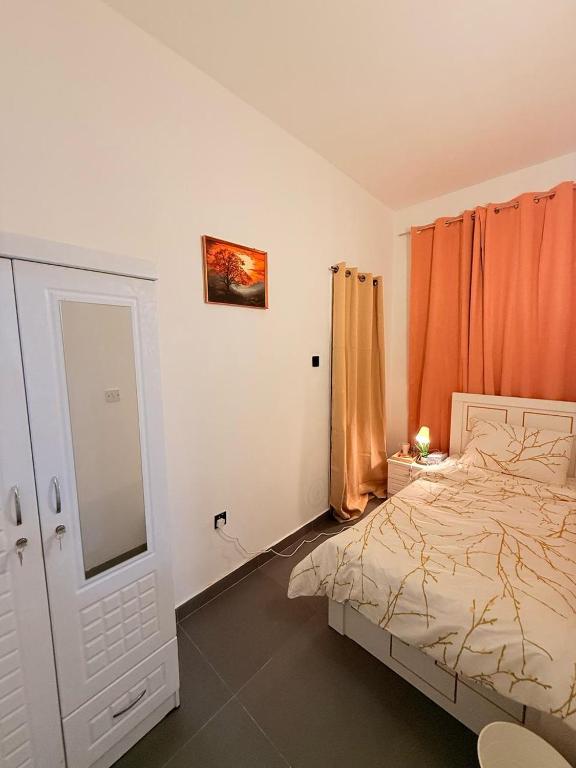 Postel nebo postele na pokoji v ubytování Orchid International