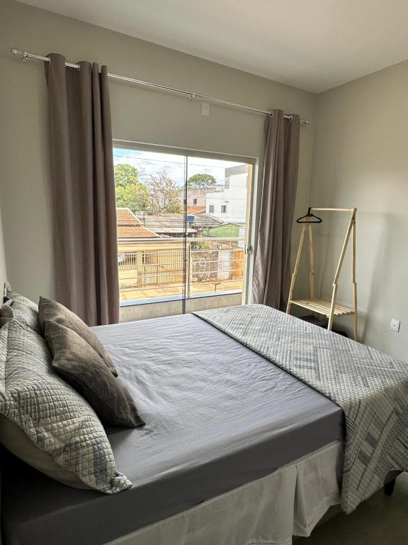 Postel nebo postele na pokoji v ubytování Apartamento Palmeira Espaço Conforto e Conectividade em Formosa