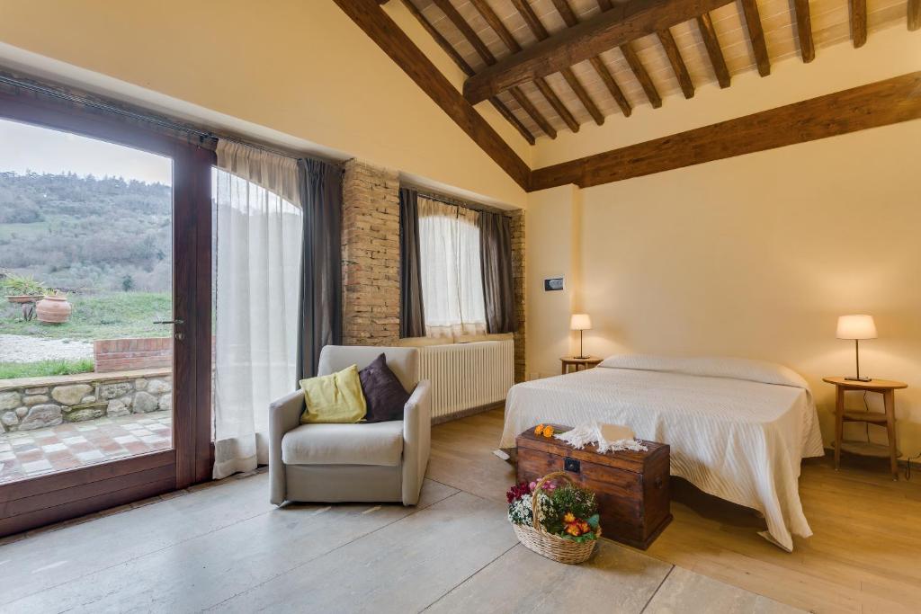 Postel nebo postele na pokoji v ubytování Agriturismo Le Canterie