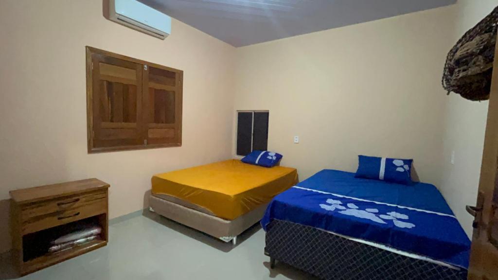 Postel nebo postele na pokoji v ubytování Casa em Alter do Chão