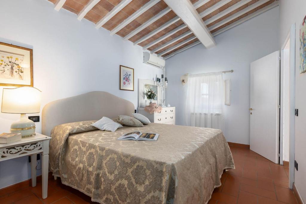 Postel nebo postele na pokoji v ubytování Relais Antico Borgo San Lorenzo