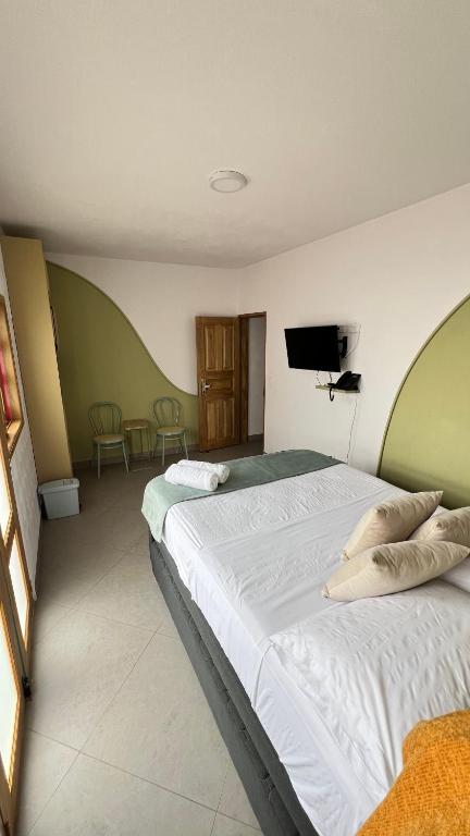 Postel nebo postele na pokoji v ubytování Hotel Chromatic