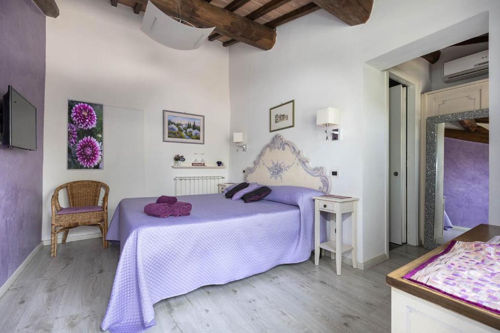 Postel nebo postele na pokoji v ubytování Relais Antico Borgo San Lorenzo