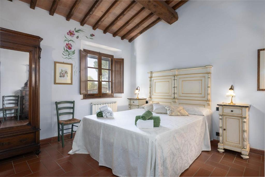 Postel nebo postele na pokoji v ubytování Relais Antico Borgo San Lorenzo