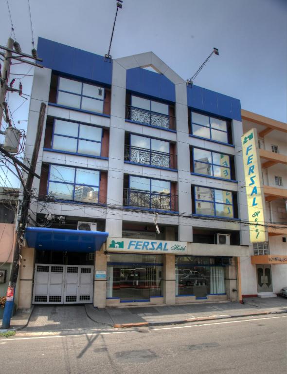 a large building with a sign on the front of it at Fersal Hotel - Manila in Manila