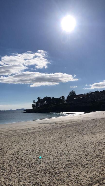 a sandy beach with the sun in the sky at O Lar do Canteiro in O Casal Pontevedra