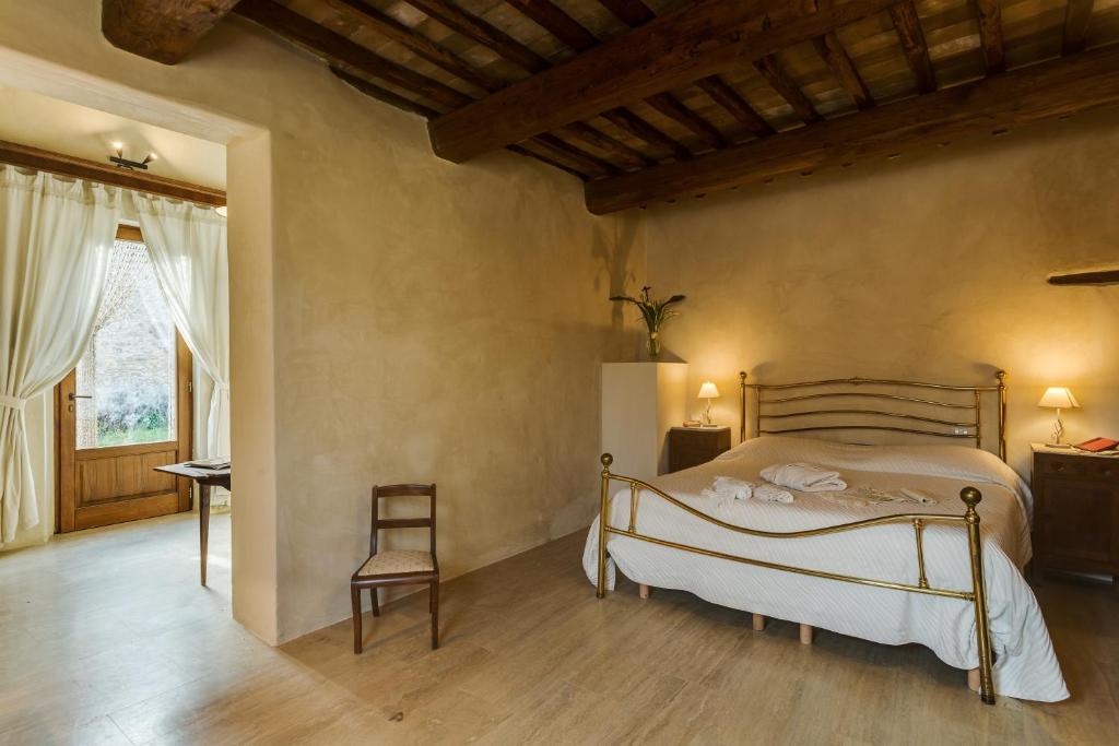 Postel nebo postele na pokoji v ubytování Agriturismo Le Canterie
