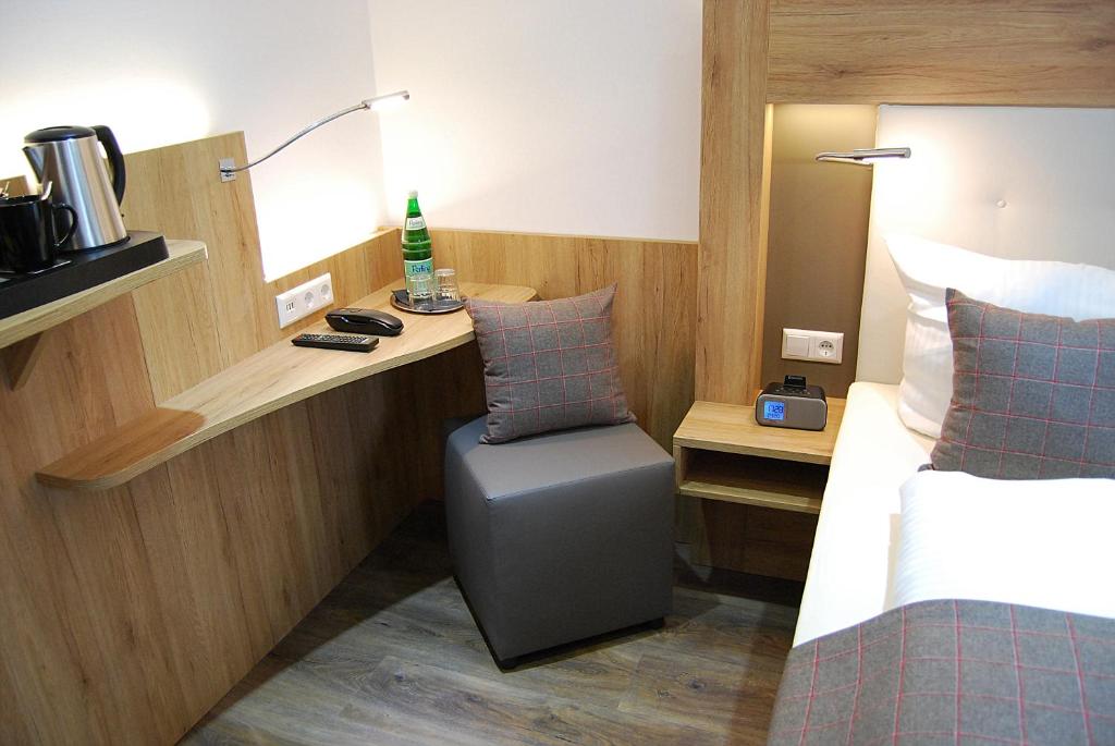 Postel nebo postele na pokoji v ubytování Hotel Am Martinsberg