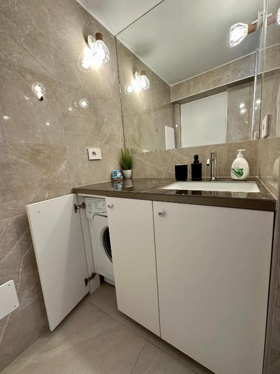 Kuchyň nebo kuchyňský kout v ubytování Cozy flat near the beach