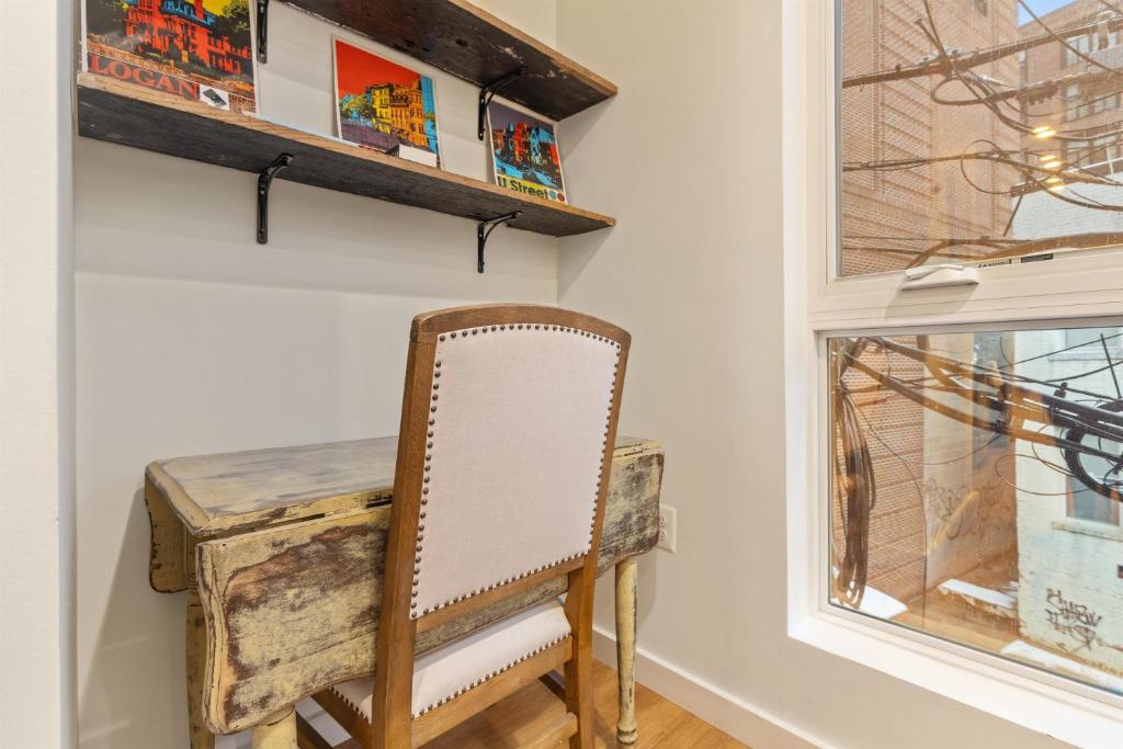 a desk with a chair next to a window at 1-BR Getaway in the Heart of Adams Morgan in Washington, D.C.