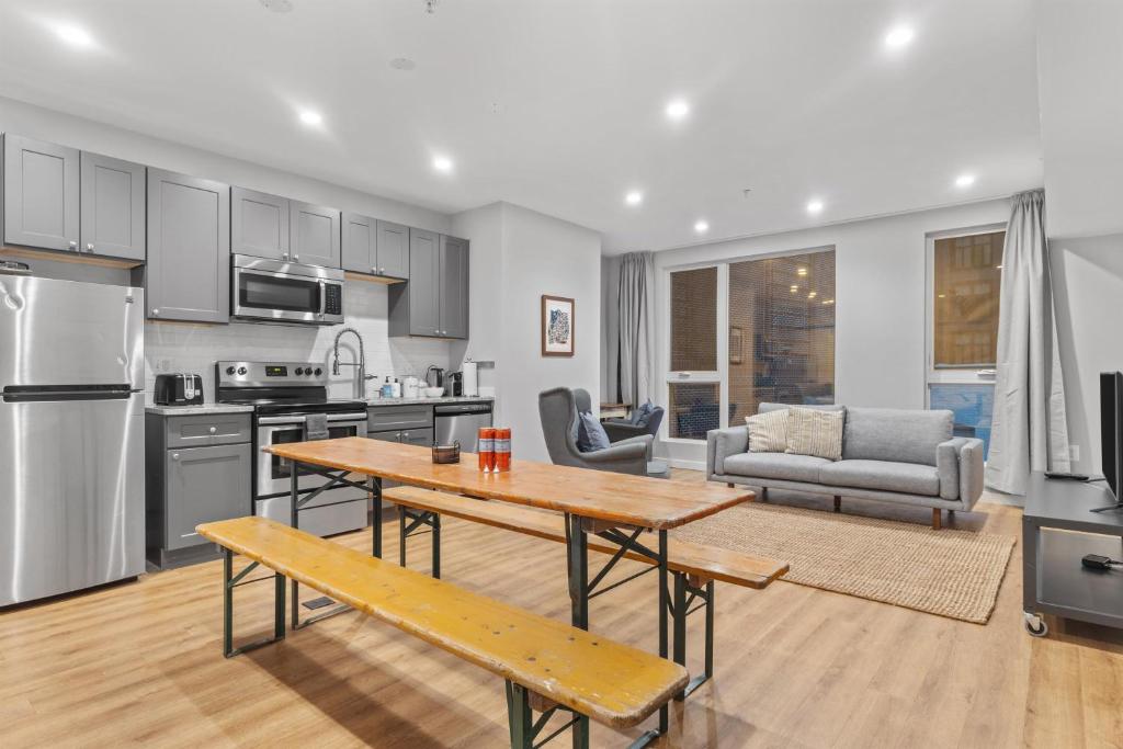 a kitchen and living room with a table and a couch at Live Like a Local in the Heart of Adams Morgan in Washington, D.C.