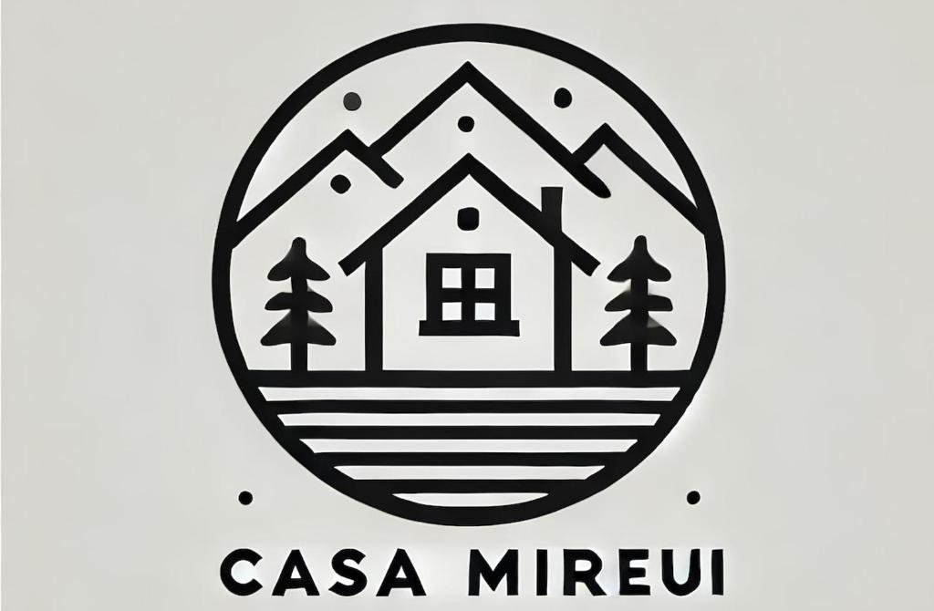 a black and white logo of a house in a circle at Casa Mireui in Miroglio