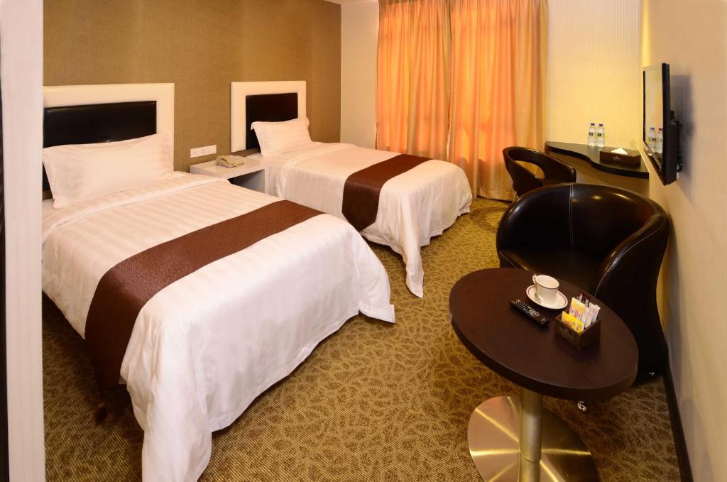 TV a/nebo společenská místnost v ubytování Hotel Nusa CT