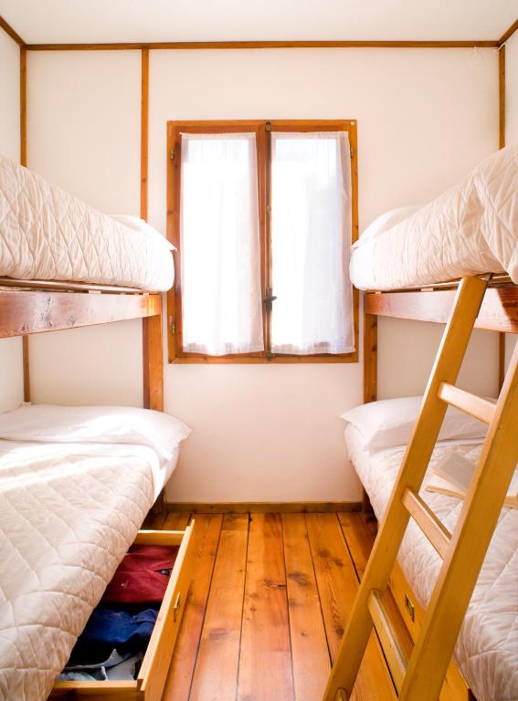 Postel nebo postele na pokoji v ubytování Camping Baciccia