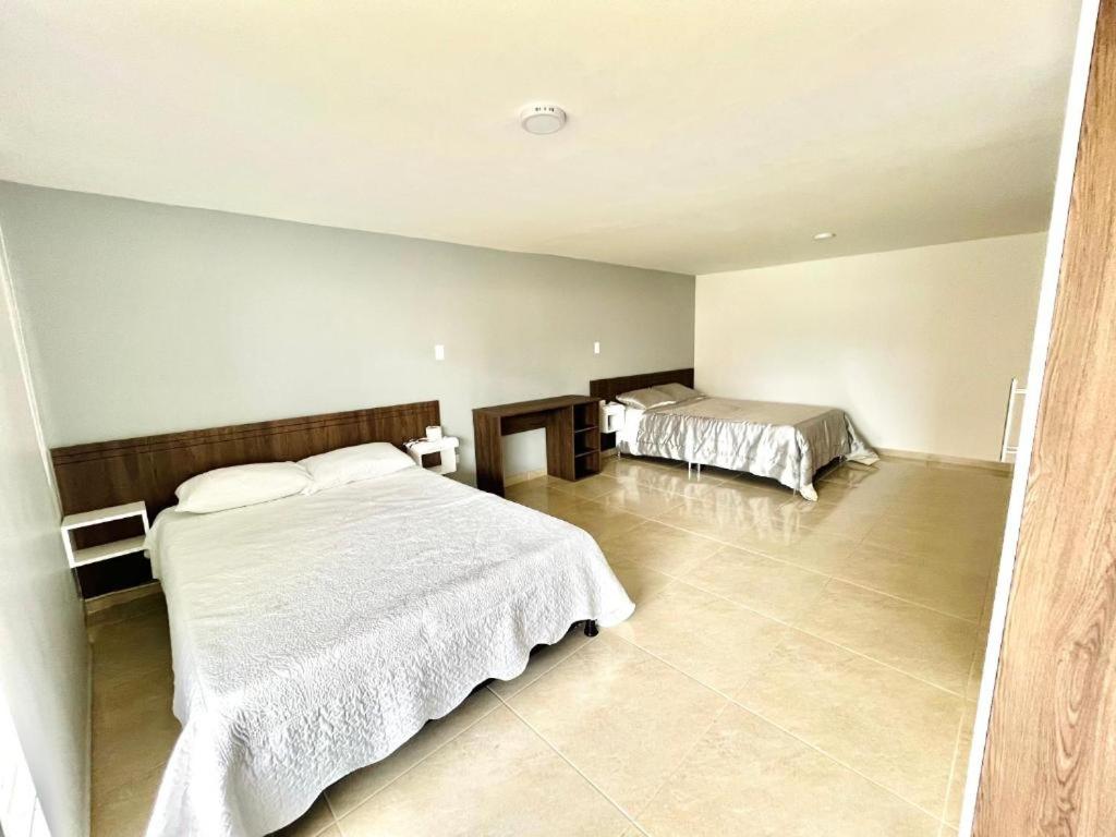 Ένα ή περισσότερα κρεβάτια σε δωμάτιο στο HERSUA HOTEL BOUTIQUE